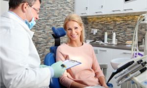 dentist explaning dental insurance coverage